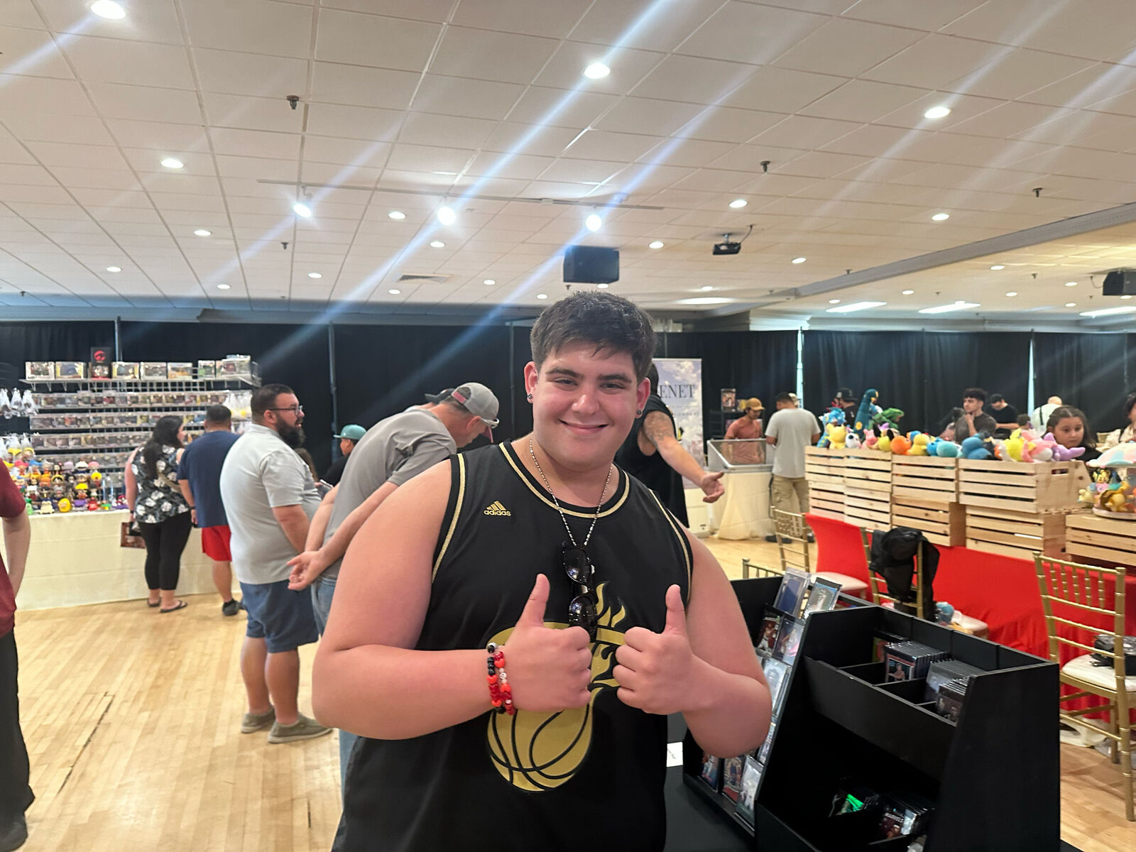 Happy collector giving two thumbs up at the show